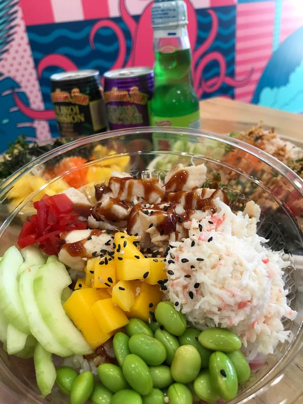 Poke bowl with chicken, crab salad, mango, edamame and cucumber